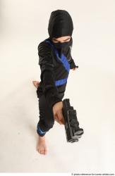 VLASTIMIL KNEELING POSE WITH GUN